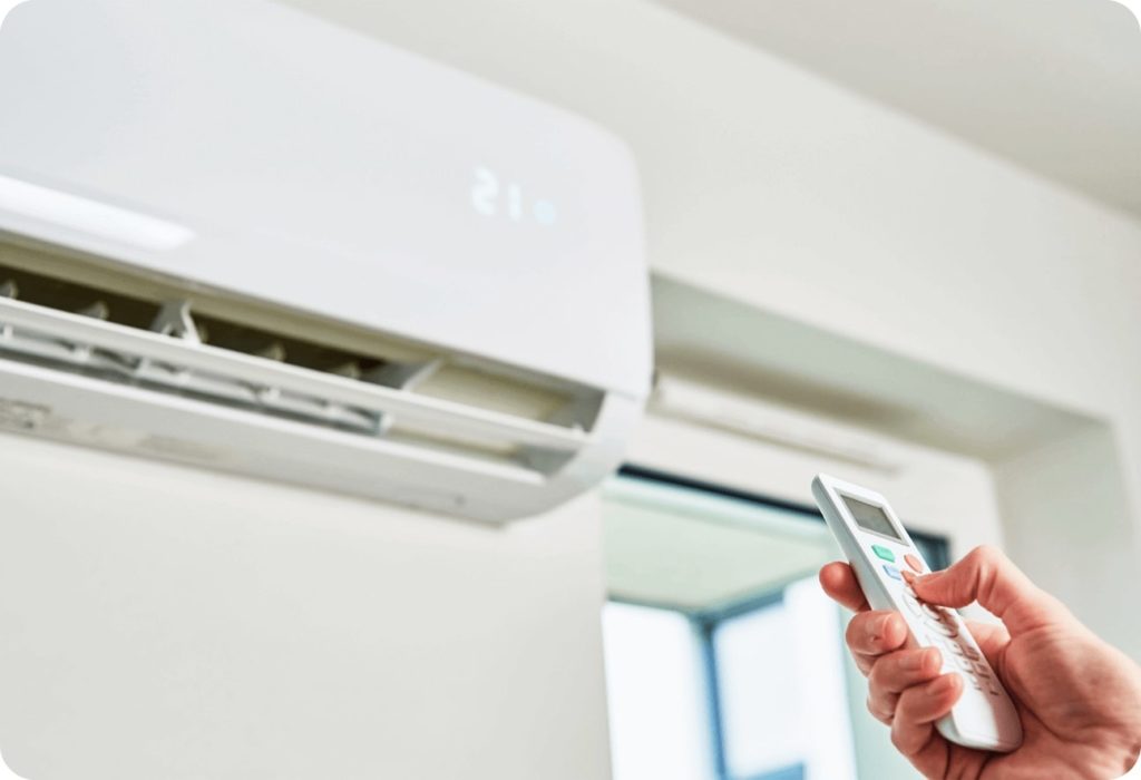 Technician installing an indoor AC unit